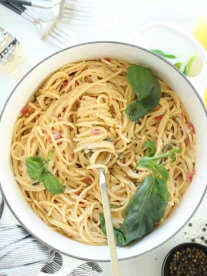 overhead image of a pot of Parmesan pasta with a fork twirling a bite
