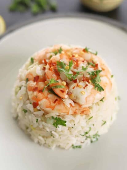 a serving of lemon garlic shrimp and rice on a plate