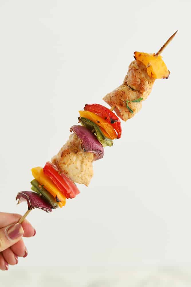 1 chipotle chicken skewer with onions and colored peppers