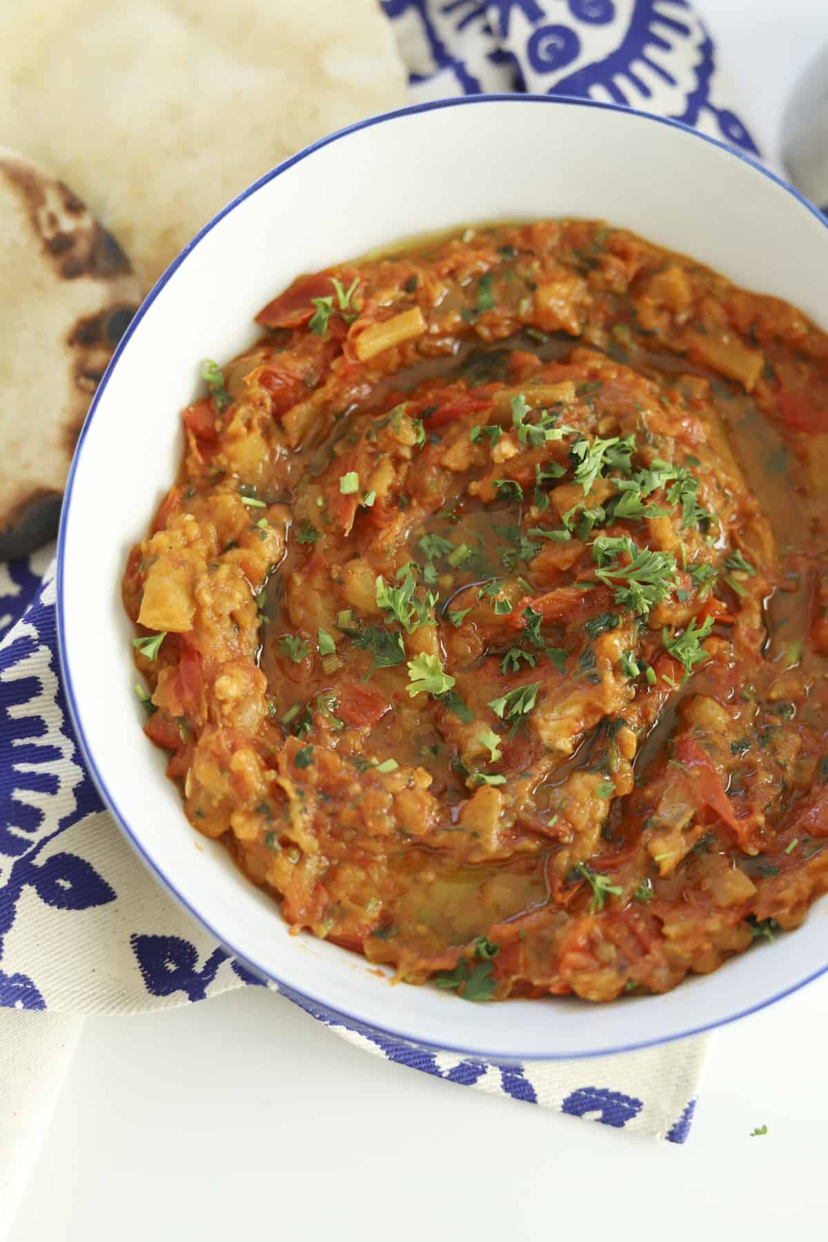 closeup overhead zaalouk with olive oil and fresh parsley 