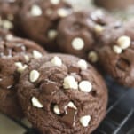 closeup double chocolate chunk cookies on a cooling rack
