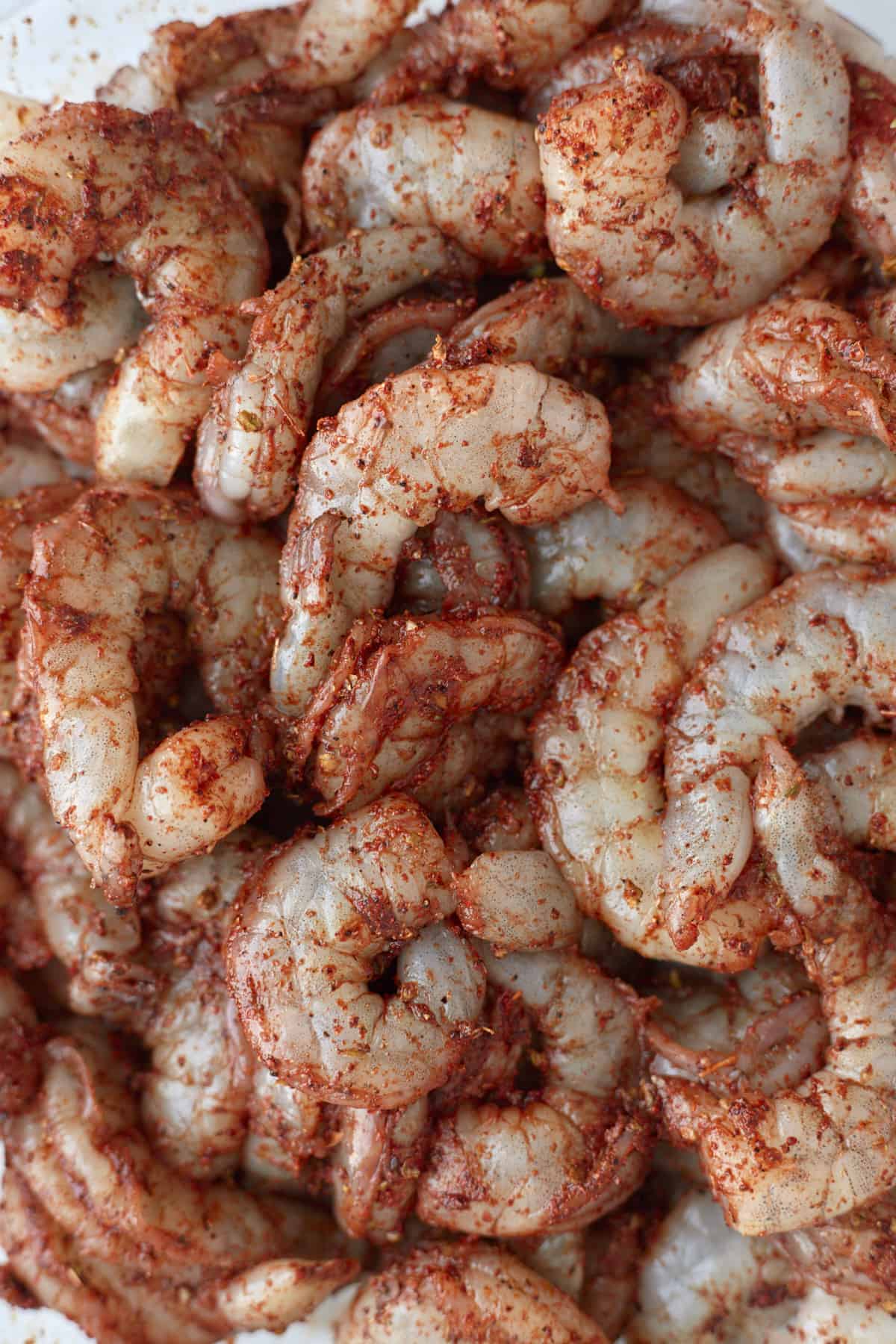 close up image of seasoned raw shrimp.