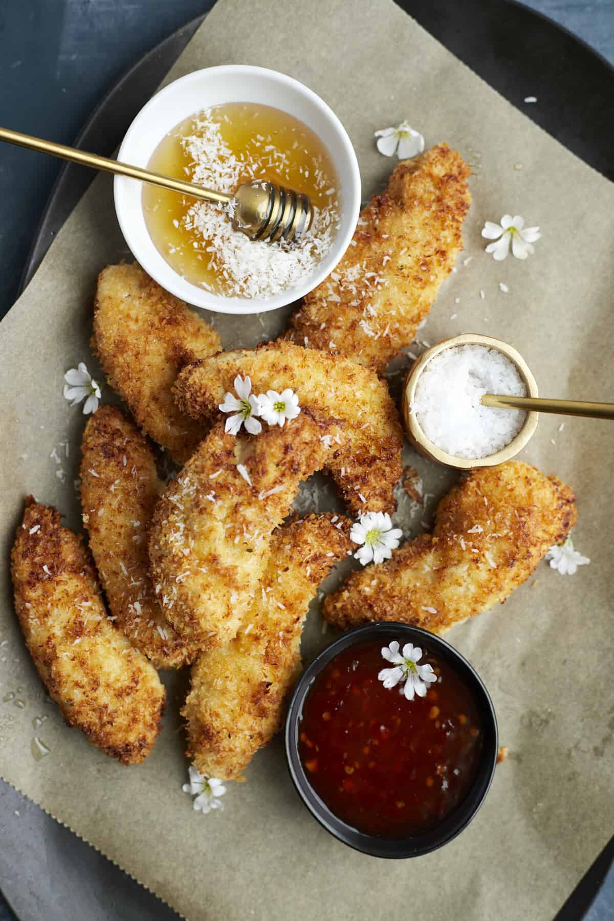Coconut Chicken tenders on a serving plate 