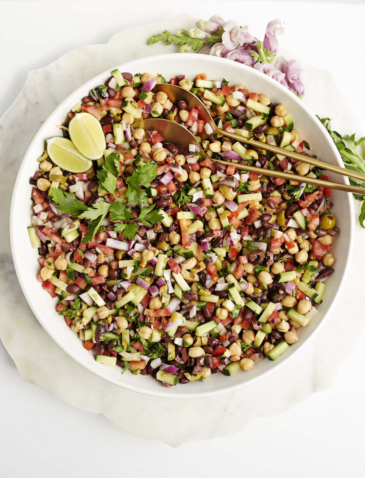 Image of a Mediterranean chickpea salad recipe in a large white bowl