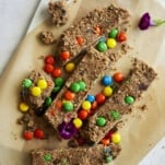no-bake monster cookie bars on parchment paper.