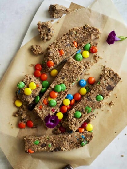 no-bake monster cookie bars on parchment paper.