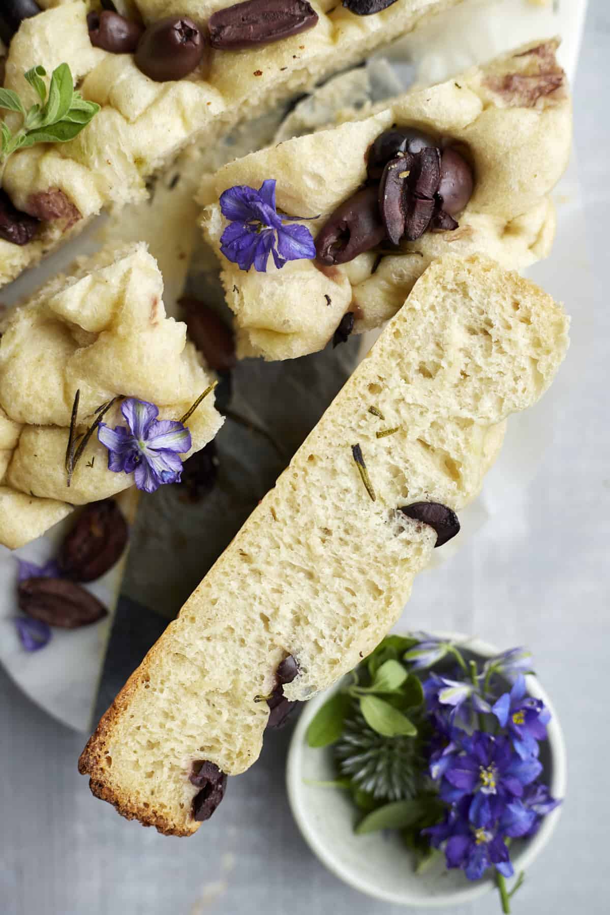 sliced easy focaccia with olives
