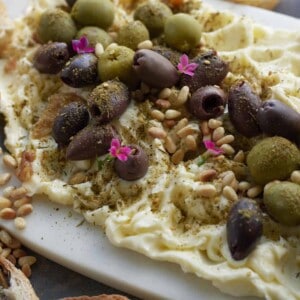butter board with olives and roasted garlic