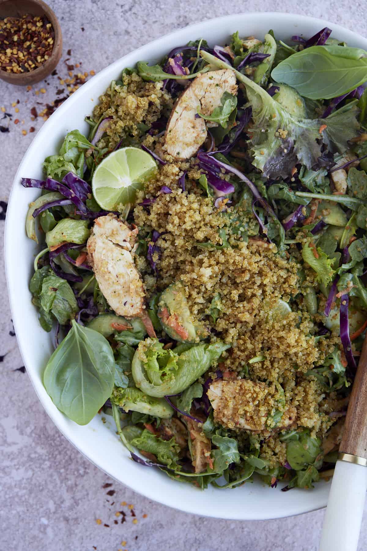 a white bowl full of crispy rice bowl salad.