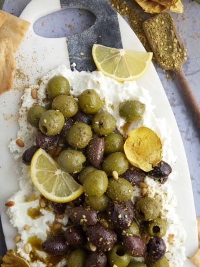 feta board topped with marinated olives.