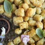 close up image of a tater tot hotdish recipe with a serving taken out
