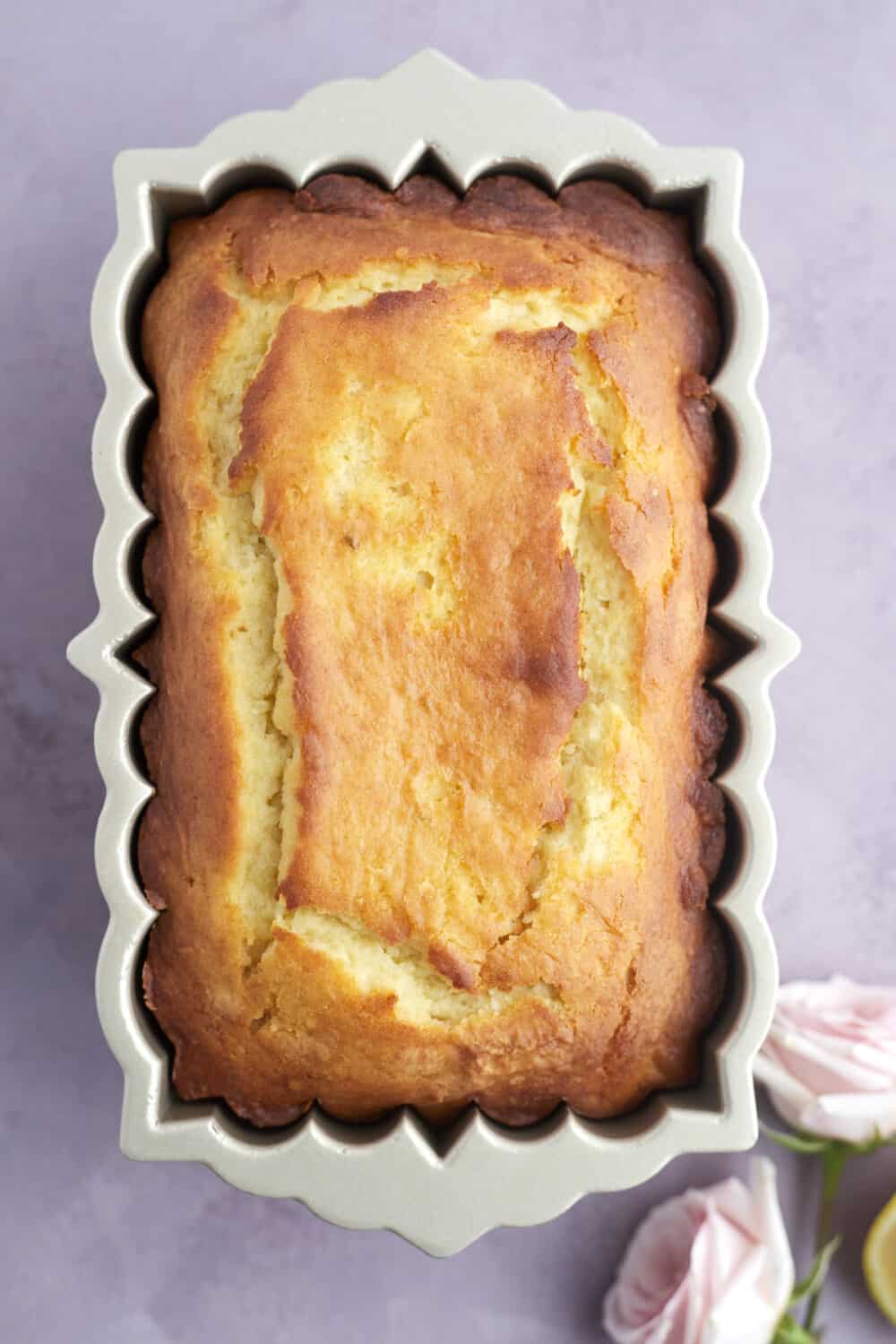 overhead image of an unglazed lemon loaf in a loaf pan