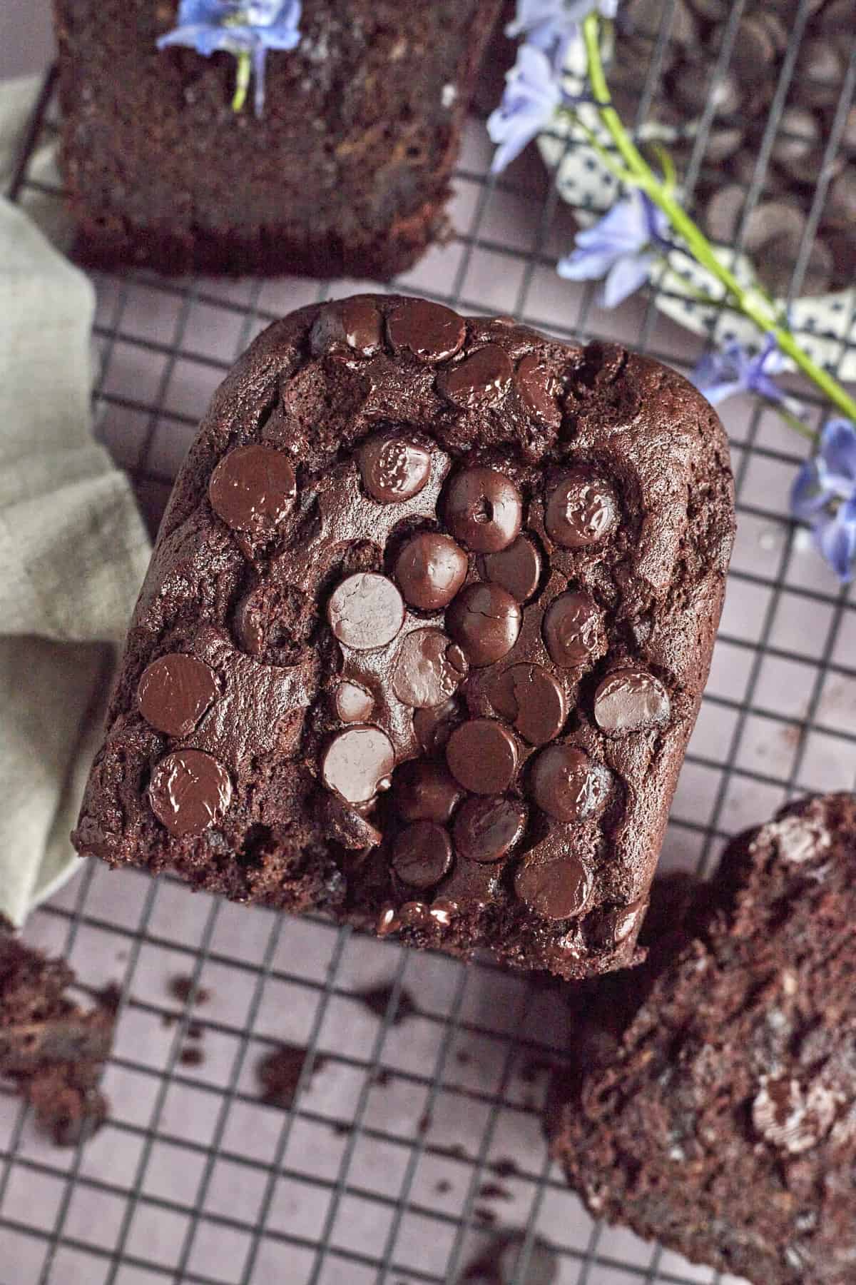 overhead image of half a loaf of double chocolate banana bread topped with extra chocolate chips