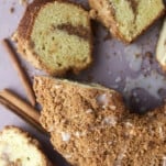 pieces of sour cream coffee cake sliced off the entire cake