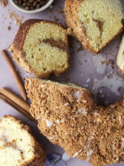 pieces of sour cream coffee cake sliced off the entire cake