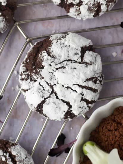 a chocolate crinkle cookie on a wire rack