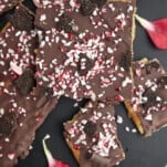 pieces of Christmas crack topped with Oreo pieces and candy canes