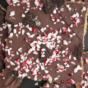 Pieces of Christmas crack topped with Oreos and candy canes