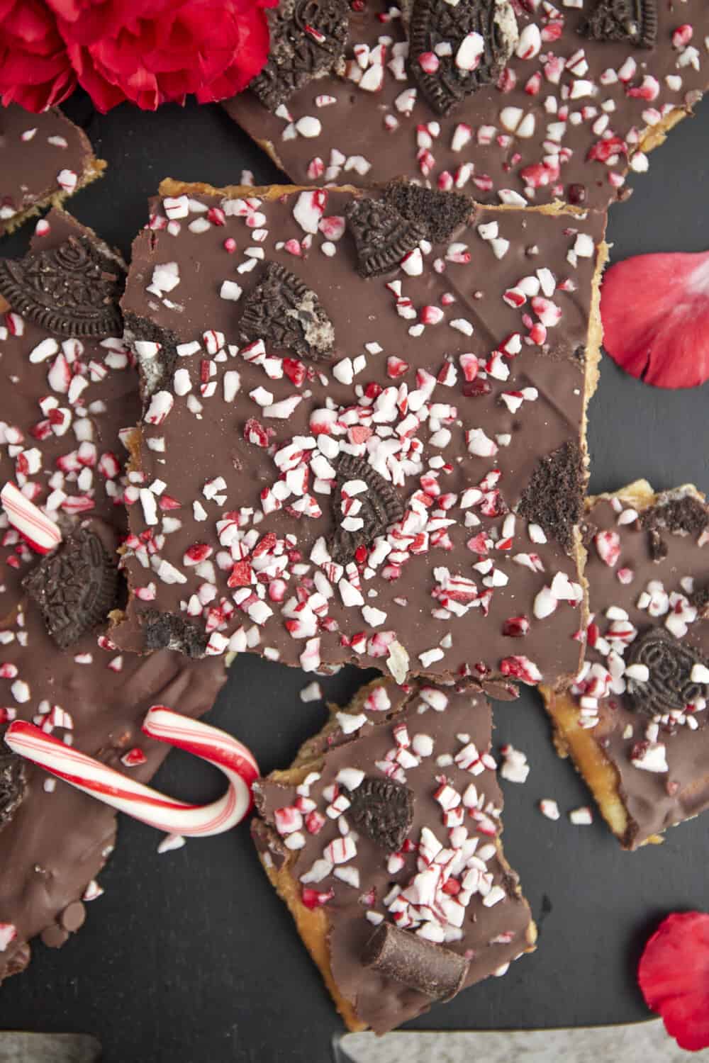 pieces of Christmas crack topped with Oreo and candy can pieces