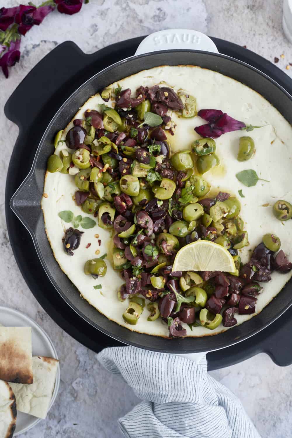 warm feta dip topped with marinated olives