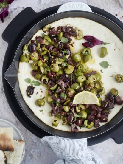 warm feta dip topped with marinated olives