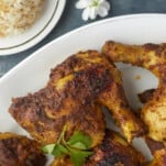 a plate full of baked Middle Eastern chicken legs