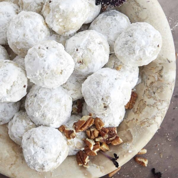 A bowl of pecan snowball cookies.