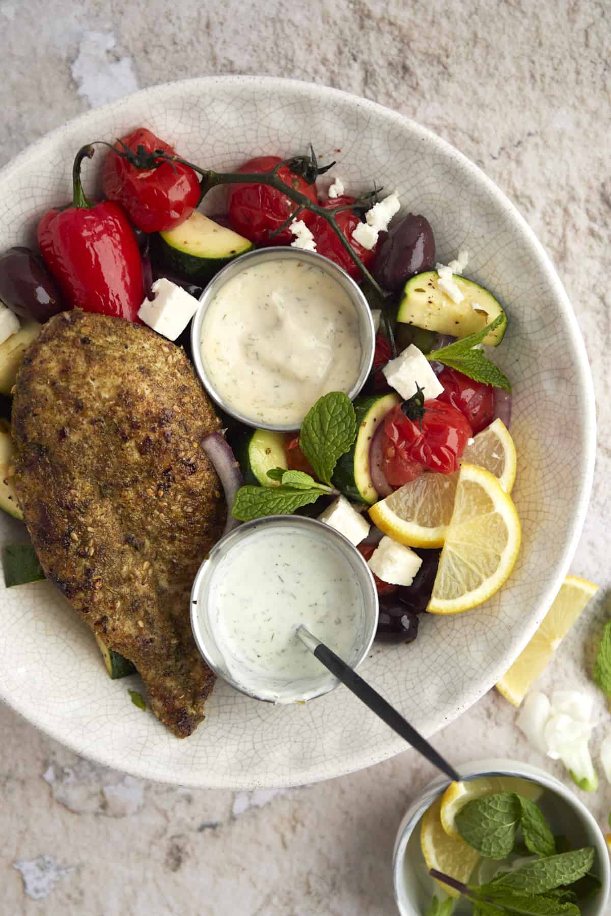 a bowl of za'atar chicken with vegetables