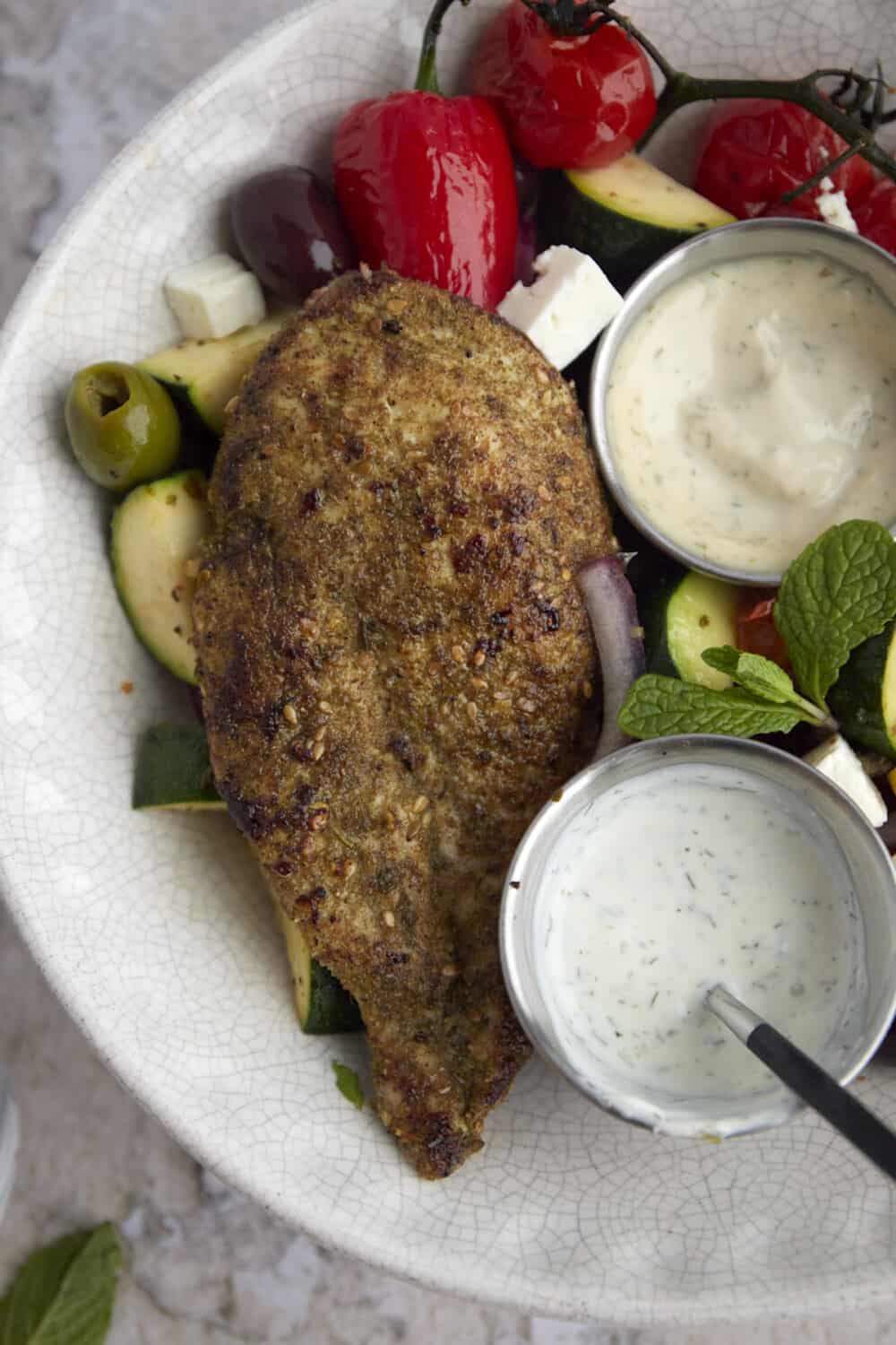 close up image of a piece of za'atar chicken 