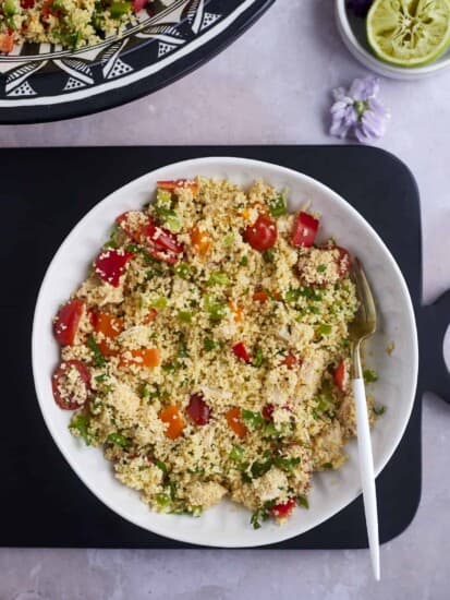 a bowl of couscous salad with chicken