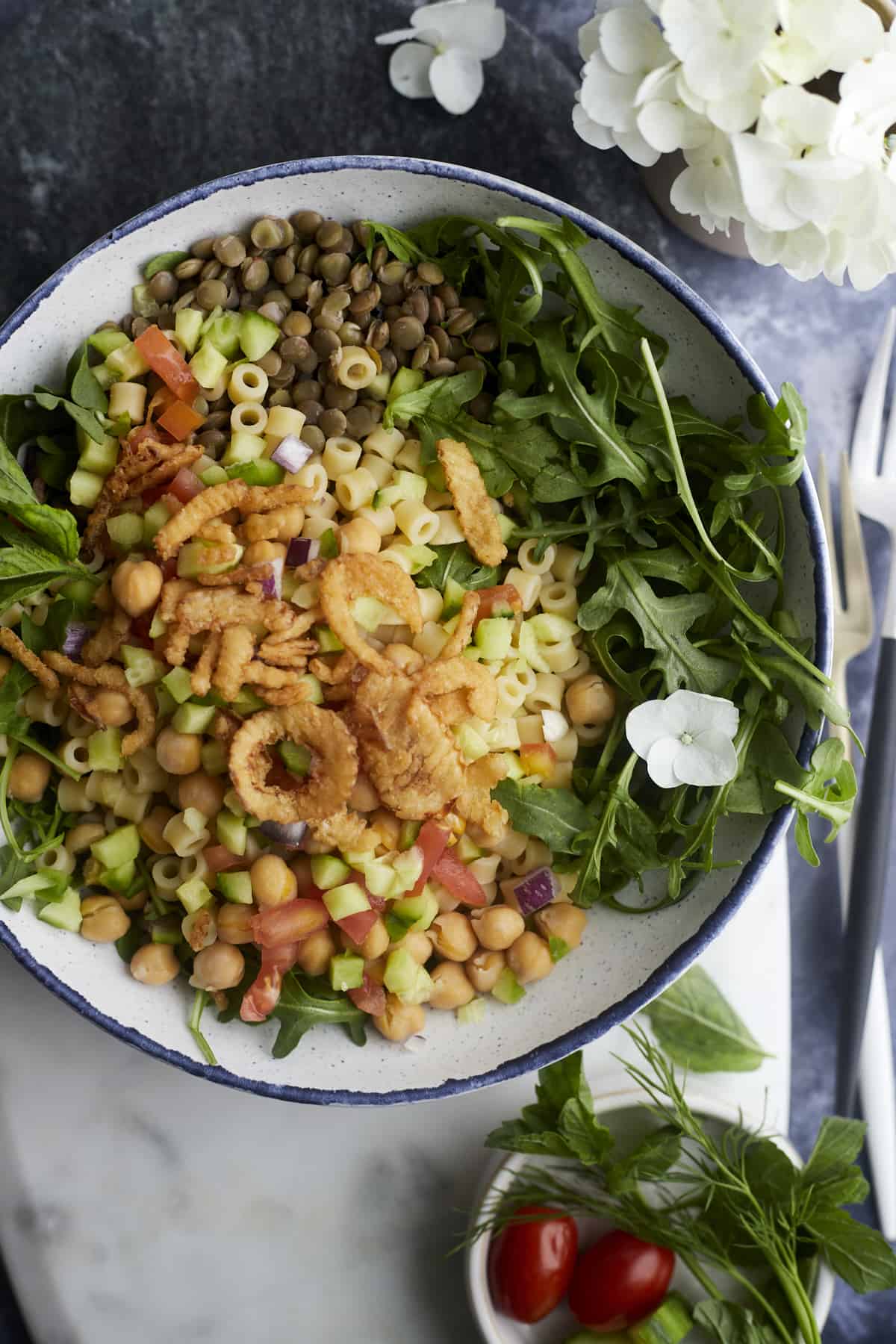 a bowl of chickpea and lentil salad