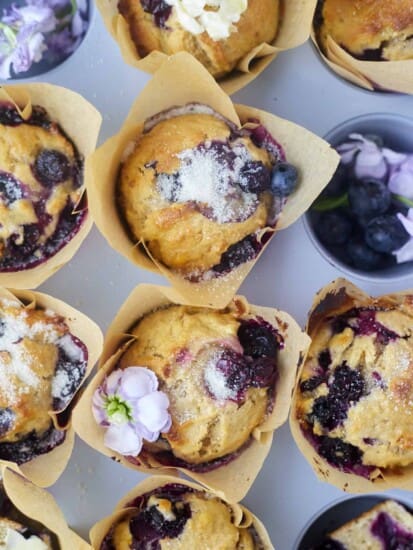 banana blueberry muffins in a muffin tin
