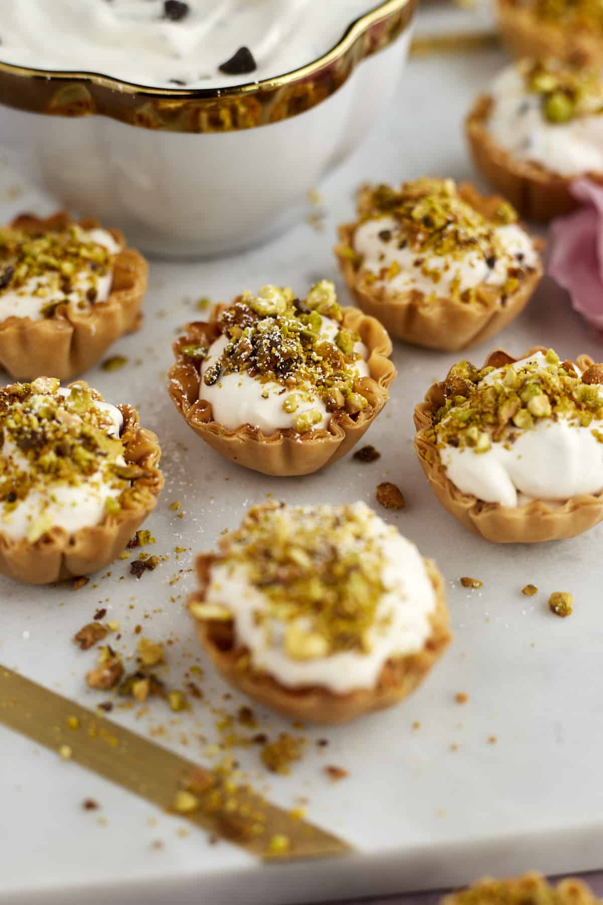 Phyllo cup cannoli bites topped with pistachios