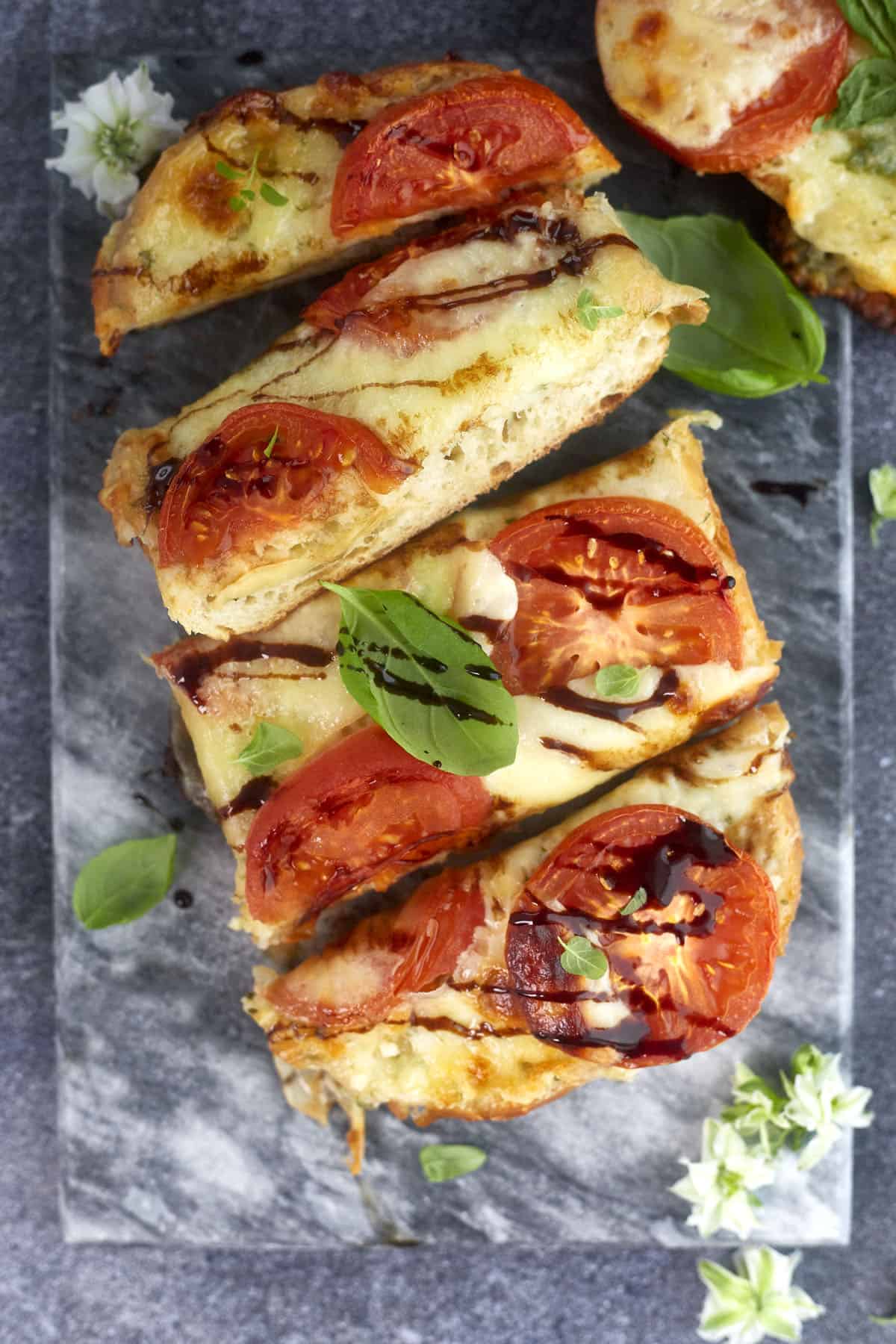 overhead image of sliced garlic caprese bread