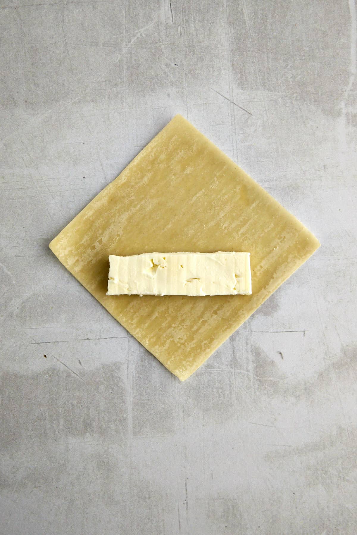 feta cheese on top of a wonton wrapper