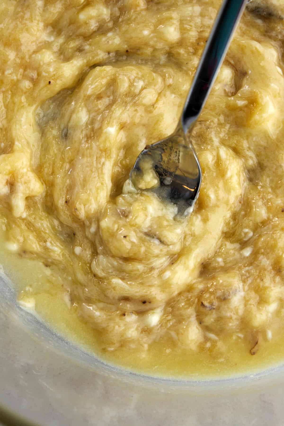 bananas being mashed with a fork