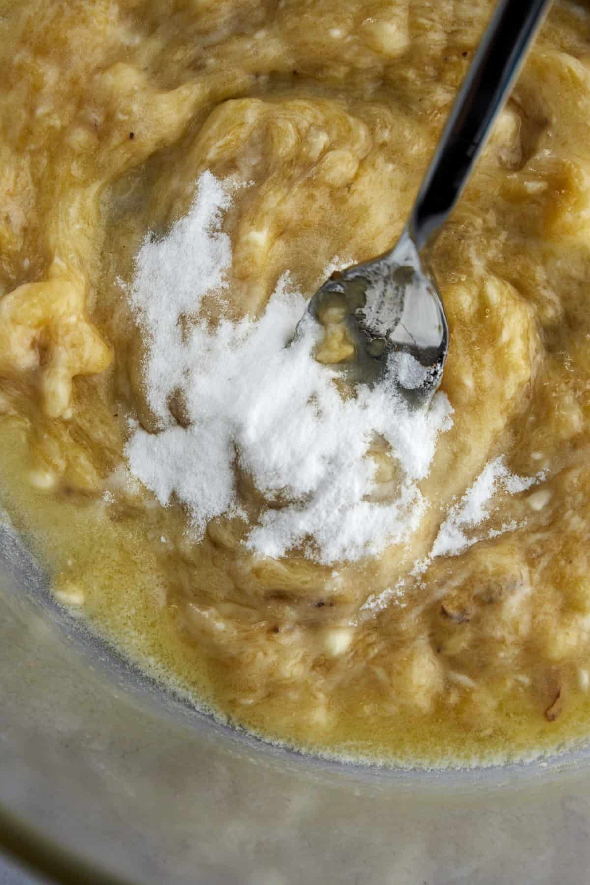 baking powder, being folded into banana bread mixture