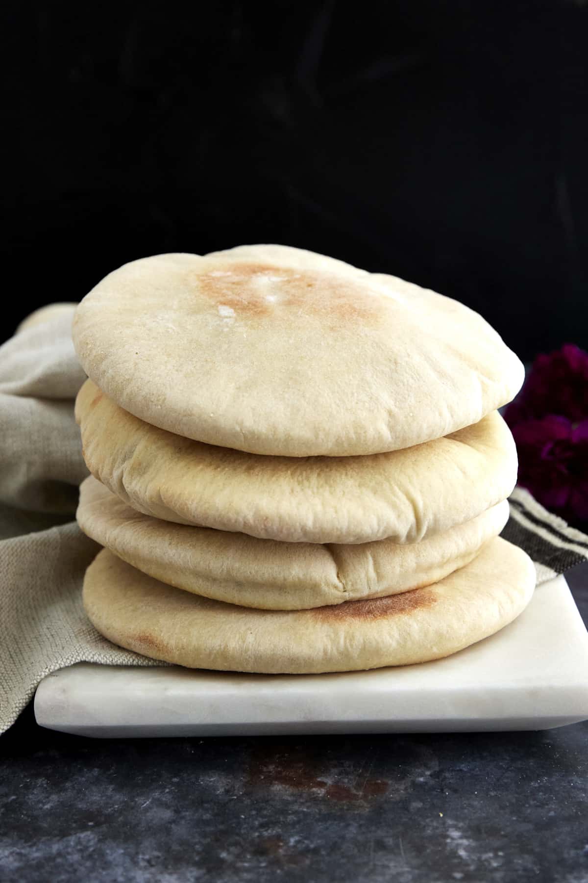 a stack of fluffy white pita bread