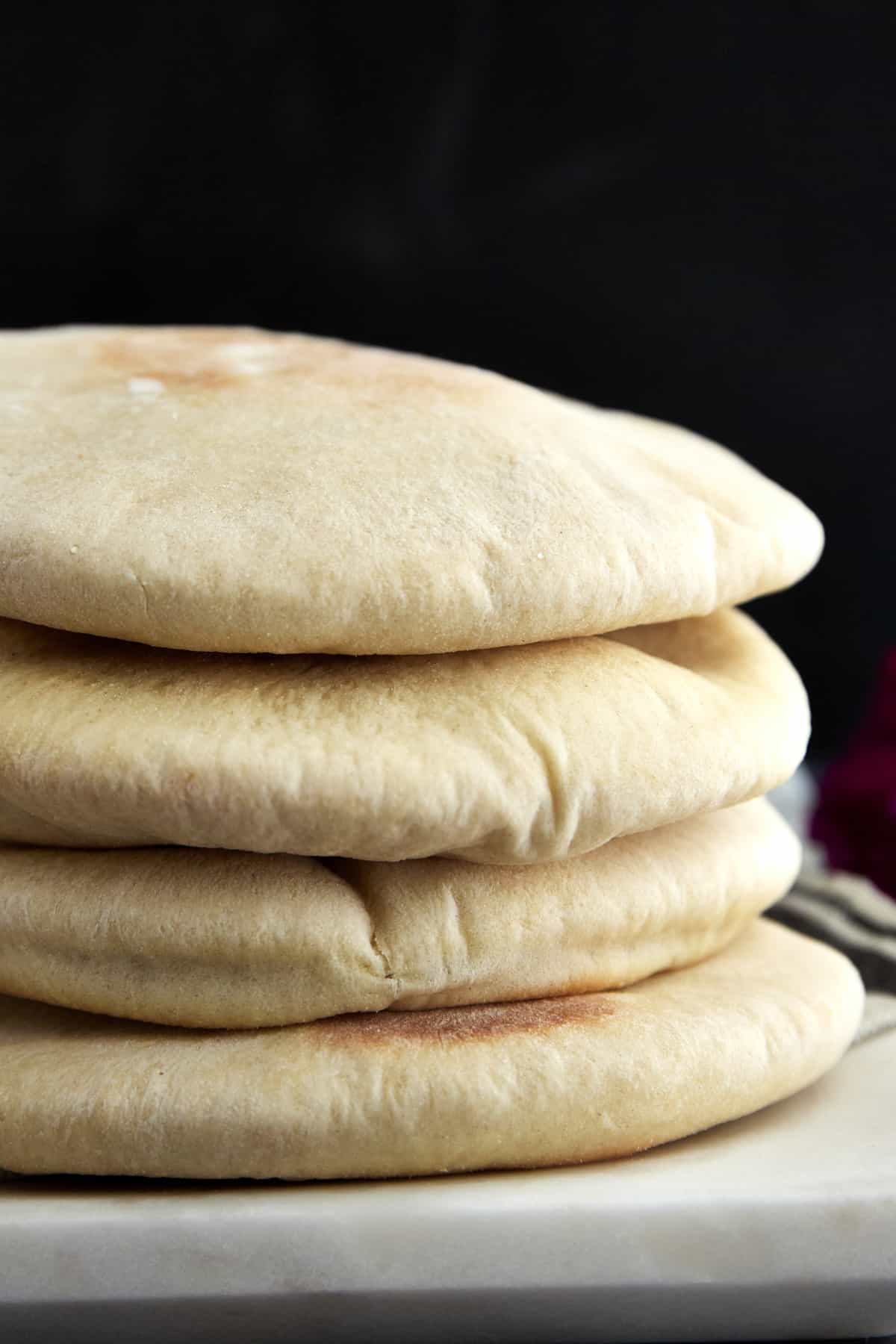 a stack of four pita pockets