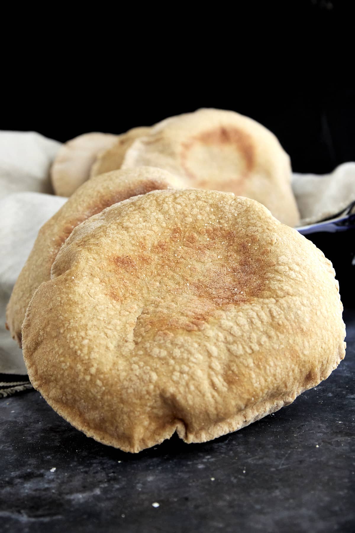 close up image of baked whole wheat pita bread