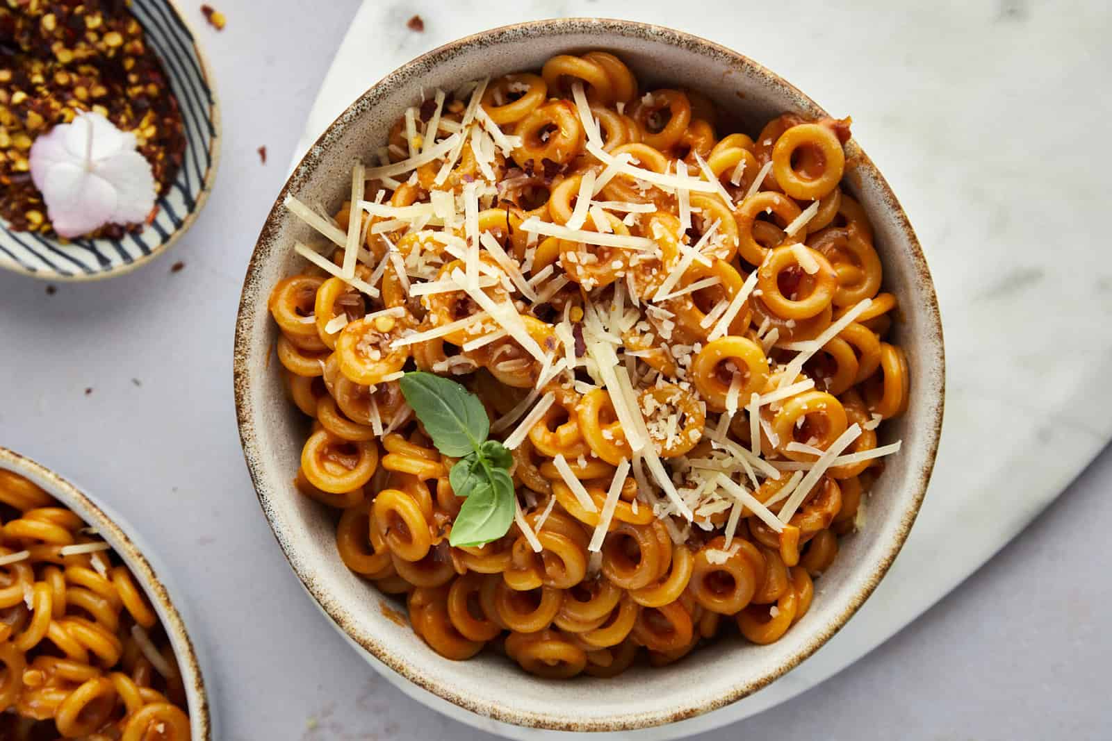 a bowl of homemade spaghetti o's topped with Parmesan