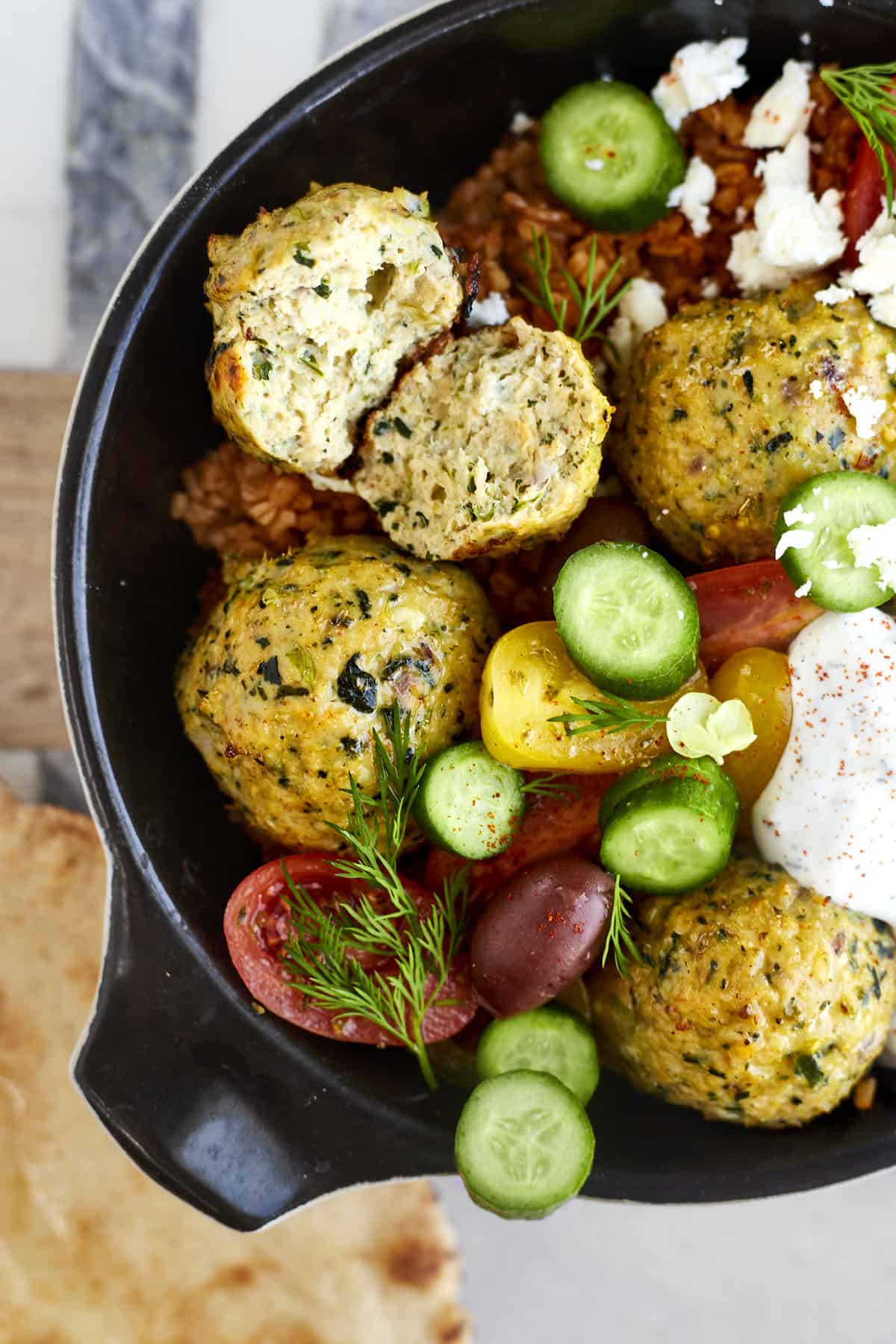 Greek meatball dinner with rice, veggies, and tzatziki