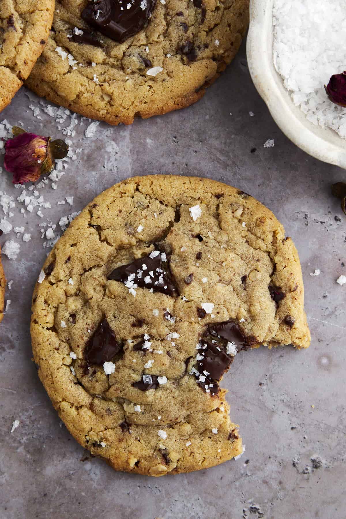a tahini chocolate chip cookie with a bite missing