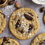 a tahini chocolate chip cookie topped with sea salt