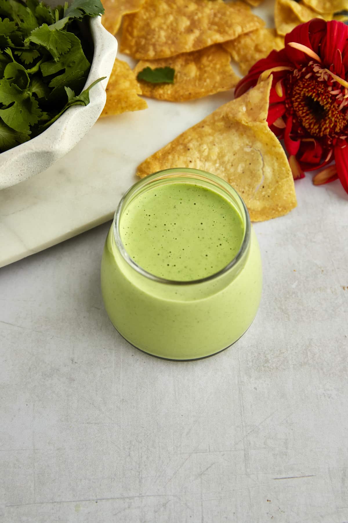 a jar of creamy cilantro yogurt dressing