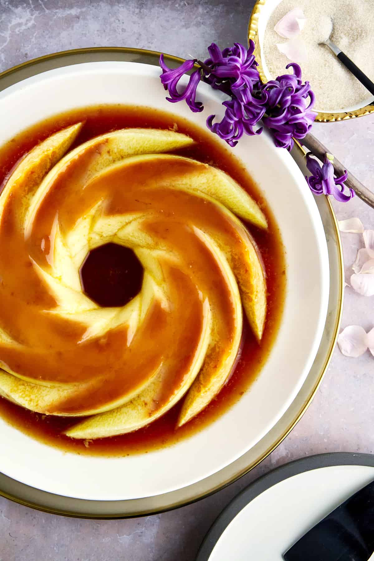 A creme caramel flan recipe on a plate. 