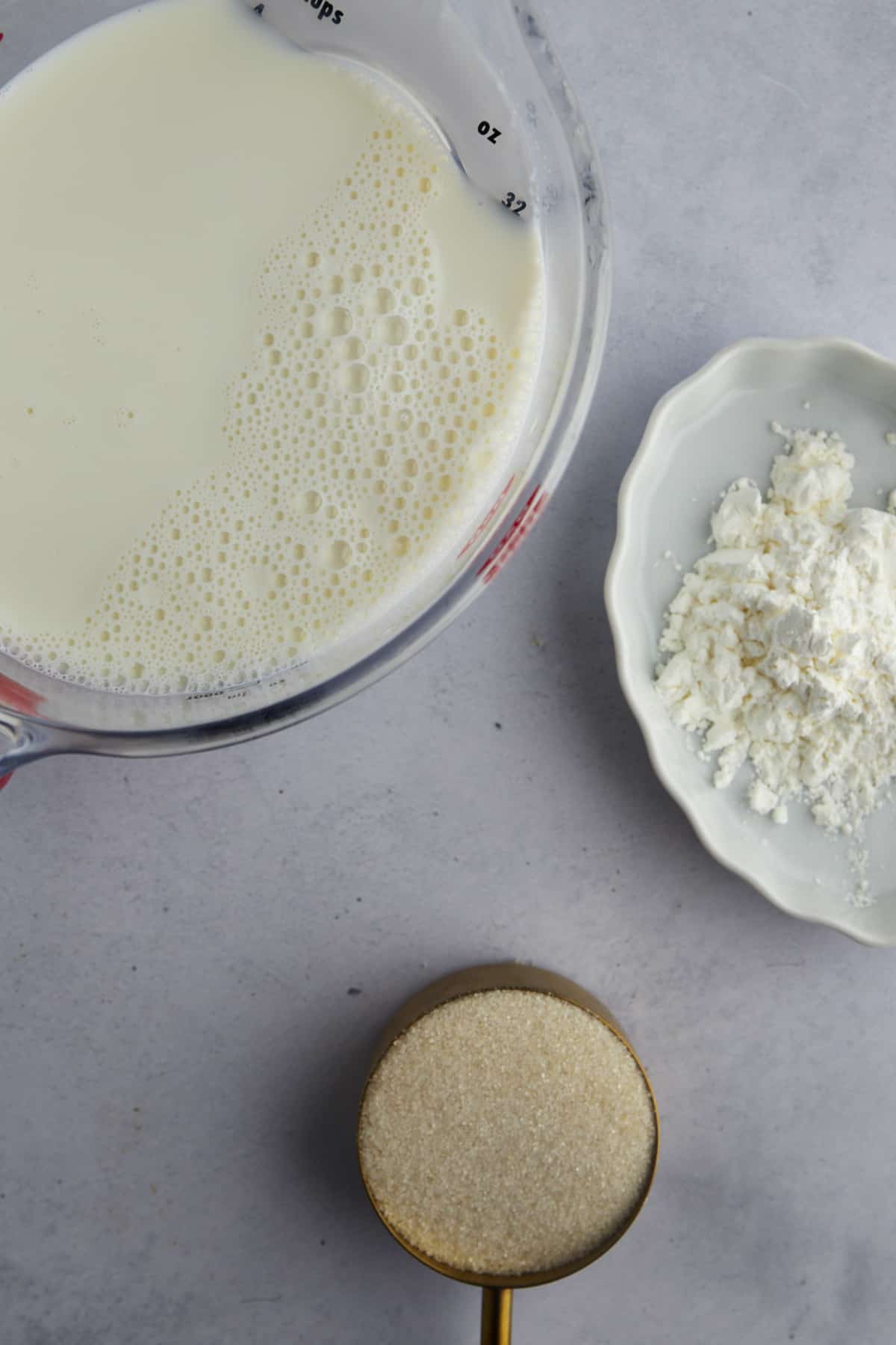 Milk, cornstarch, and sugar to make Mahalabia. 