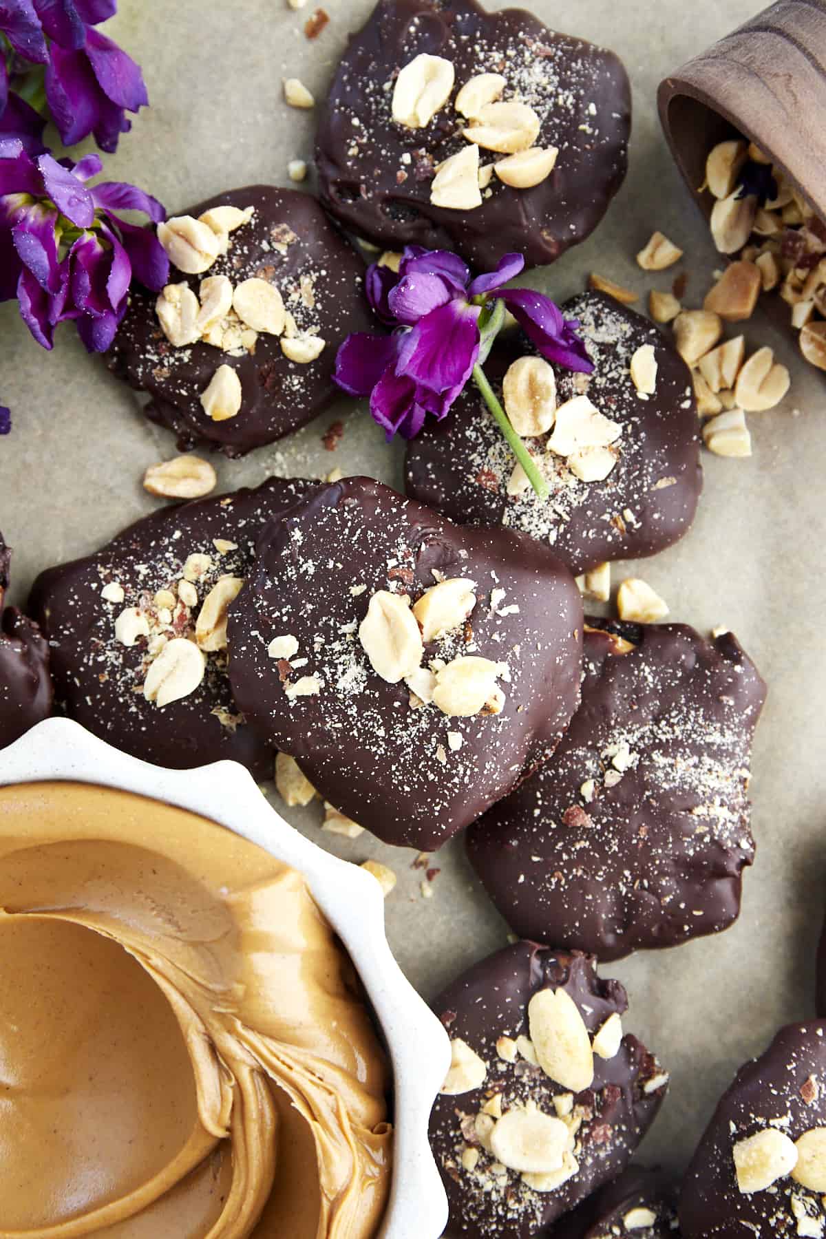 Chocolate covered dates topped with peanuts. 