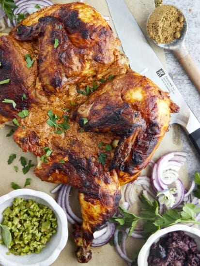 A butterflied whole roasted chicken with shawarma spices.
