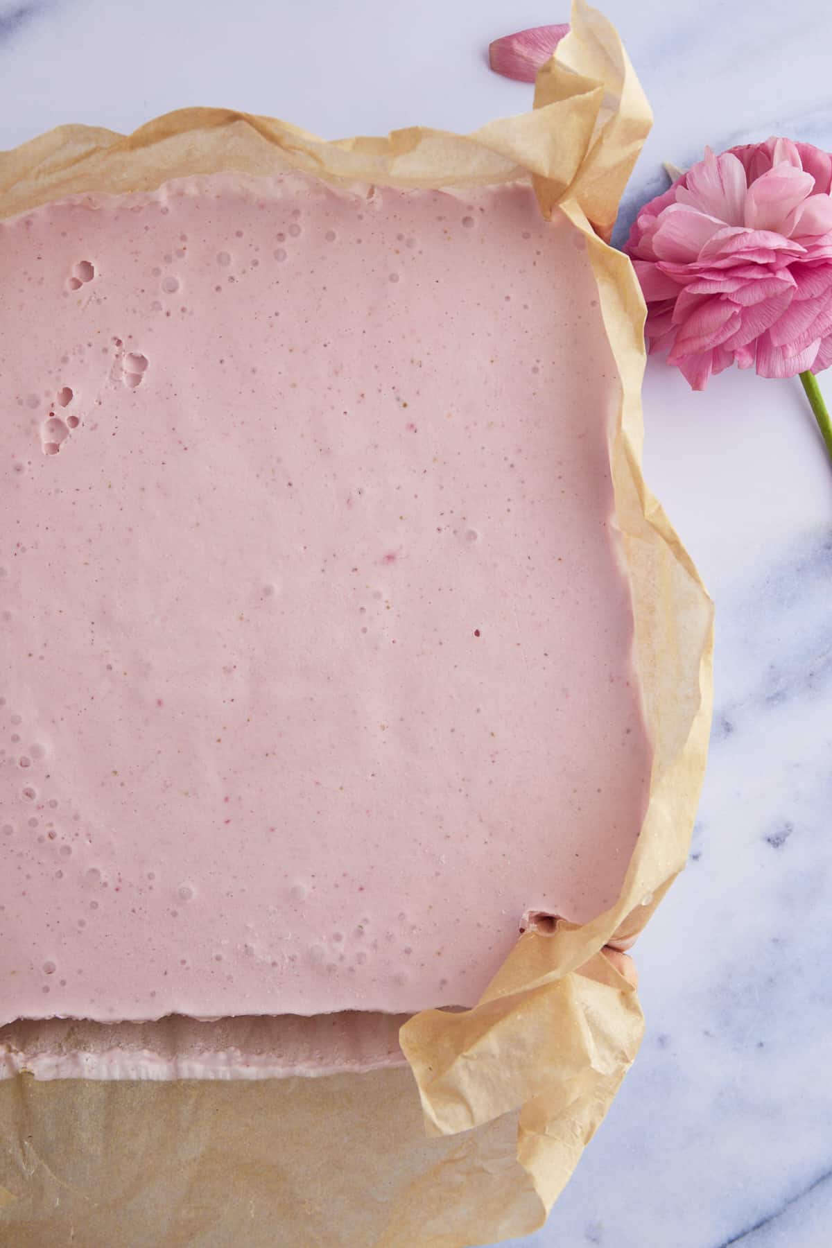 A baking dish of no-bake cheesecake squares. 